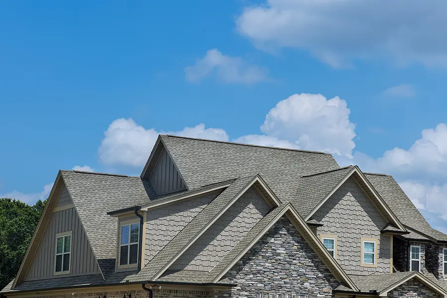 Close up of a brand new roof on a two story house.